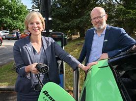 Transport Minister Lilian Greenwood (L) with BVRLA Chief Executive Toby Poston utilising the Raw charging facilities at the Alton Towers Hotel.JPG